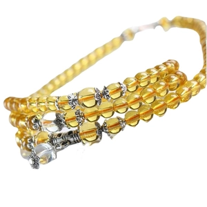 Multilayer yellow and purple glass bead bracelet with silver charms and accents