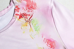 Detail shot of the round neckline and shoulder area of the pink printed maxi dress
