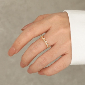 Minimalist S925 sterling silver crown ring with sparkling zircons on a model's finger