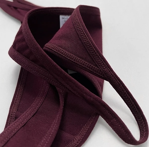 Detail of deep purple cotton thong showing fine stitching and high-quality knitted fabric