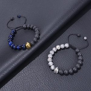 Detail of beaded warrior helmet bracelet with blue tiger eye and volcanic lava stones