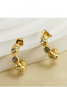 Detail of 18K gold plated U-shaped earrings with zircon, lead and nickel-free