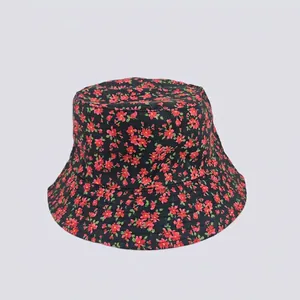 Detail of floral bucket hat showing cotton fabric and red flower print pattern