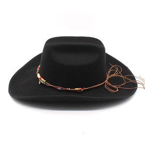 Detail of black wool felt jazz hat featuring colorful wooden beads and tassel trim