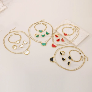 Detailed set of gold plated titanium steel necklaces and earrings in four colors