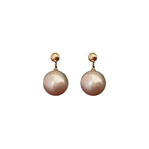 Minimalist champagne pearl stud earrings with gold plating on a clean white background