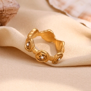 18K gold plated stainless steel ring featuring rose shapes with small diamond accents