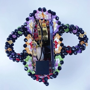 Internal view of handmade colorful beaded bag showing texture and storage capacity