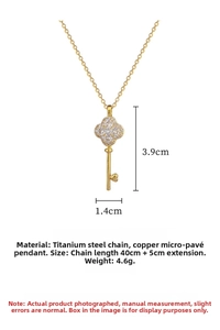Macro view of clover key pendant featuring micro-pave crystals and titanium steel chain