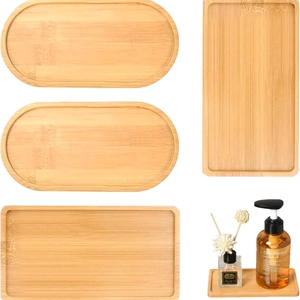 Set of oval and rectangular bamboo trays showing natural wood grain on white background