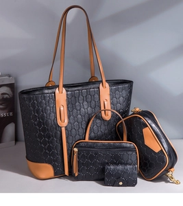 Four-piece black textured leather tote bag set with brown trim and geometric embossed details