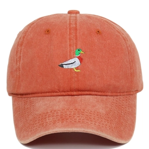 Detail of green mallard duck embroidery on vintage washed cotton red baseball cap