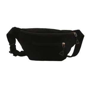 Minimalist black corduroy waist bag with dual zipper compartments and adjustable strap