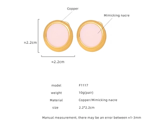 Detail view of pink faux shell earrings in gold-plated copper with 2.2cm dimensions