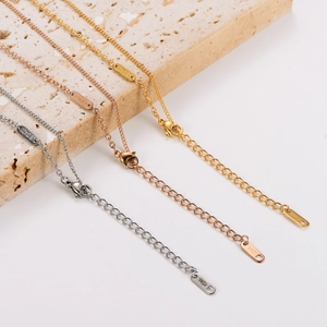 Detailed view of gold, rose gold and silver gourd necklaces with 18KGP engravings