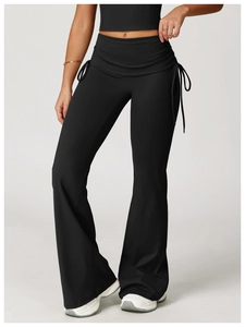 Detail view of high-waisted flare yoga pants with fold-over waistband and side drawstring
