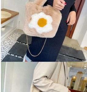 Detail of plush tote bag featuring a cute fried egg pattern and gold metal chain strap