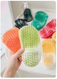 Detail showing non-slip silicone hexagon grips and Angel lettering on cotton yoga socks