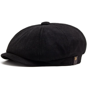 Classic black newsboy cap in textured knit fabric with vintage side metal button detail