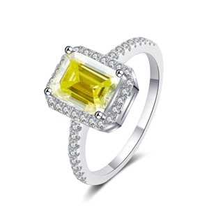 Detailed macro view of an emerald-cut yellow moissanite ring set in polished silver S925
