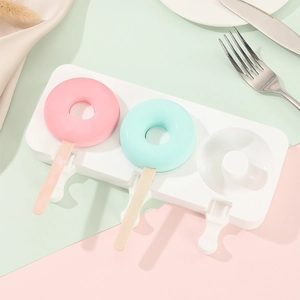 Detailed view of three-cavity donut shaped silicone ice cream molds with colorful popsicle sticks