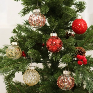 Set of six festive PET painted Christmas balls hanging on a decorative tree branch