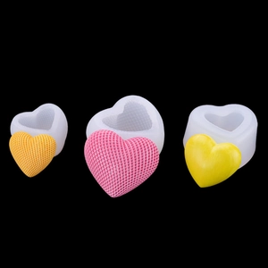 Detailed view of 3D heart silicone molds with textured mesh patterns for mousse cake