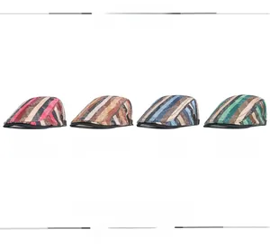 Detailed view of paisley and stripe patterns on retro flat caps in four assorted colors