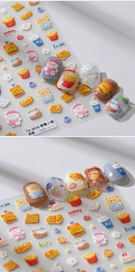 Close-up of 3D embossed nail stickers featuring picnic bear and fast food patterns