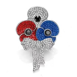 Poppy red blue and white rhinestone flower brooch with elegant bow tassels on white background