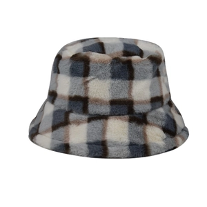 Detailed view of the soft plaid faux fur bucket hat featuring blue and grey checkered plush