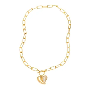 Gold heart pendant necklace with paperclip chain and toggle clasp in polished finish