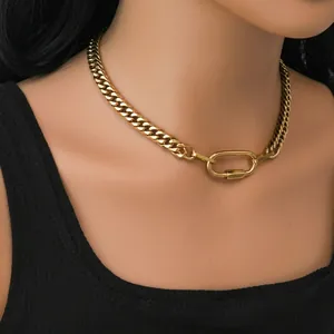 Polished stainless steel gold cuban link necklace with stylish carabiner clasp on model