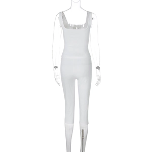 Detail view of white ribbed knit fabric texture on two-piece tank top and leggings set