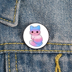 Cartoon blue and pink gradient cat enamel pin on denim jacket with stars pattern