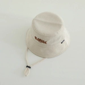 Close-up of beige corduroy kids bucket hat with FLORIDA embroidery and windproof strap