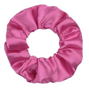 Close-up of a glossy pink satin scrunchie showing smooth silk texture and soft folds
