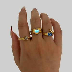 Three-piece gold irregular open ring set with round, heart, and rectangle colorful stones
