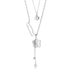 Detail of silver layered necklace with butterfly, safety pin, and round crystal charms