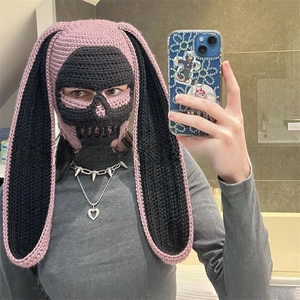 Detail of pink and black crochet skull balaclava with long rabbit ears and gothic design
