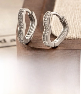 Detail of silver heart hoop earrings with zircons and 10mm inner diameter spec