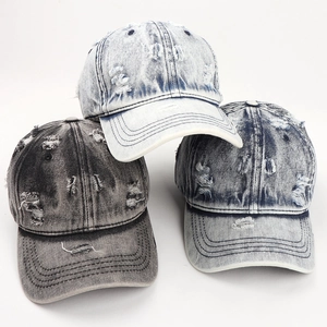 Three-pack vintage washed denim baseball caps with distressed ripped details in various colors