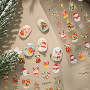 Christmas nail art stickers with watercolor snowman reindeer and tree designs