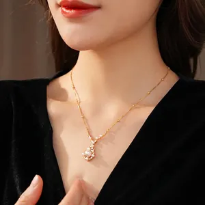 Gold plated pearl pendant necklace with zircon accents on a fine chain jewelry