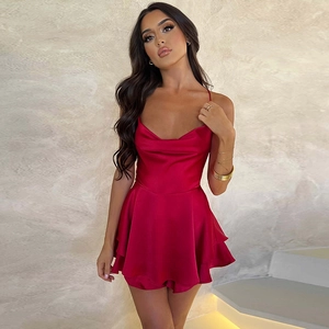 Detail of the elegant red satin short dress featuring a draped cowl neck and thin straps