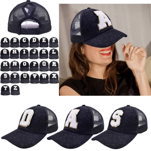 Detail of navy mesh baseball cap with leopard patch letter and ponytail hole design
