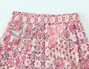 Close-up of elastic high waistband and floral pattern on lightweight chiffon skirt