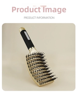 Detail of curved golden hairbrush with boar bristles and anti-slip rubber handle