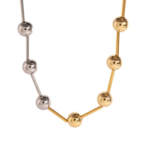 Two-tone 18k gold plated stainless steel bead and bar necklace on white background