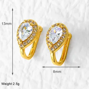 Macro detail of gold plated teardrop ear cuff with sparkling zircon stone and micro-pave